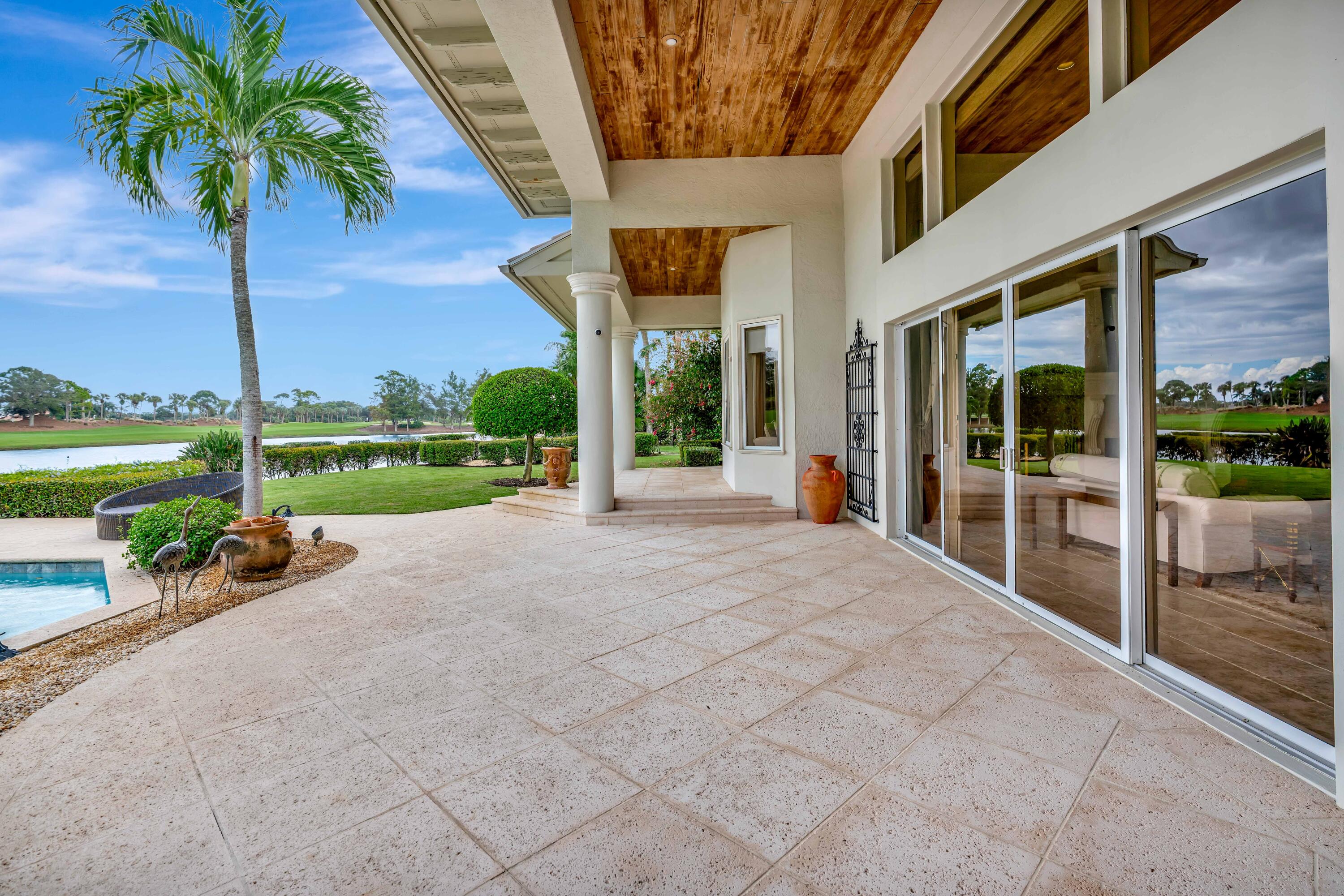 266 Locha Drive Jupiter, FL 33458 - Photo 37 of 60 a view of a house with backyard and porch