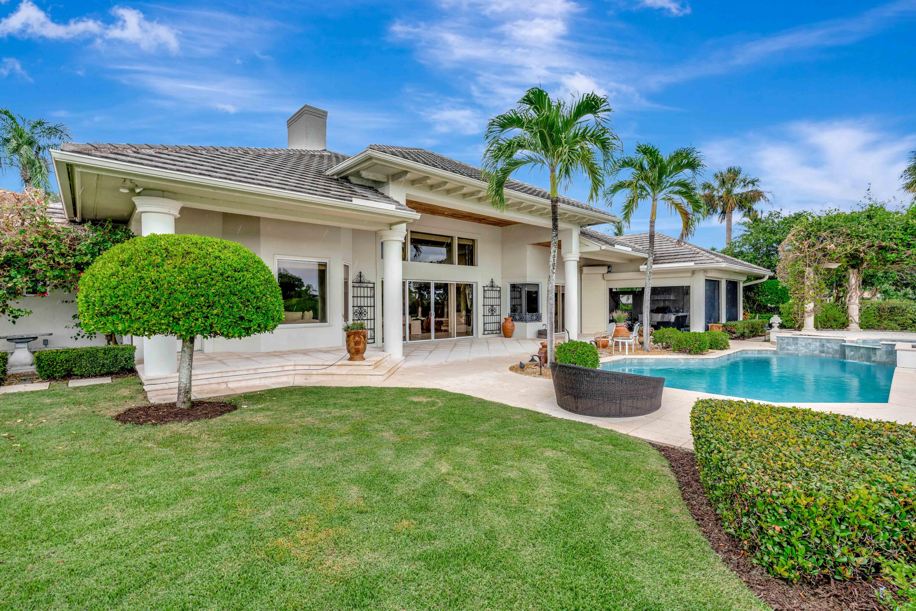 266 Locha Drive Jupiter, FL 33458 - Photo 43 of 60 a view of a house with a yard patio and swimming pool
