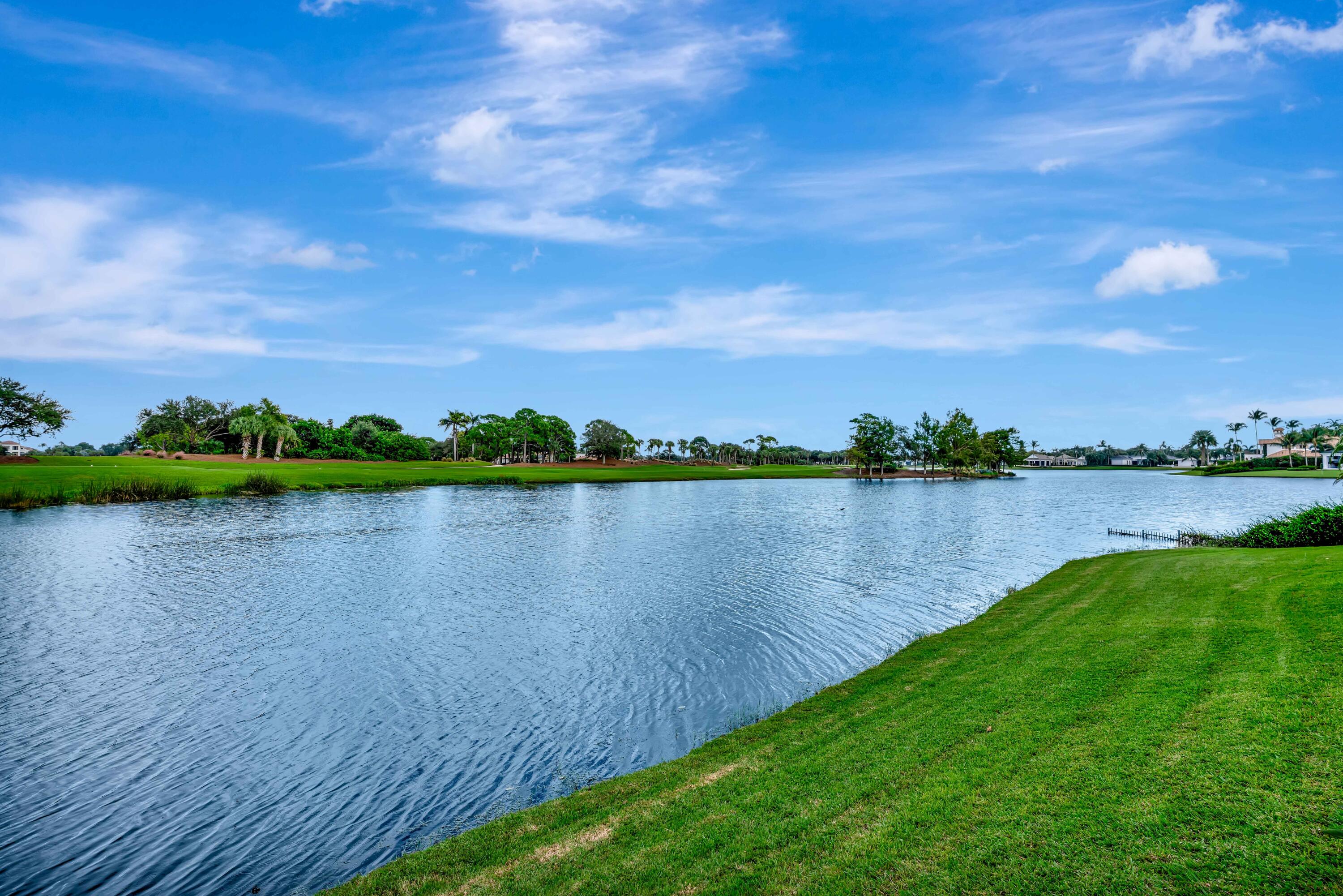 266 Locha Drive Jupiter, FL 33458 - Photo 47 of 60 a view of a lake from a yard