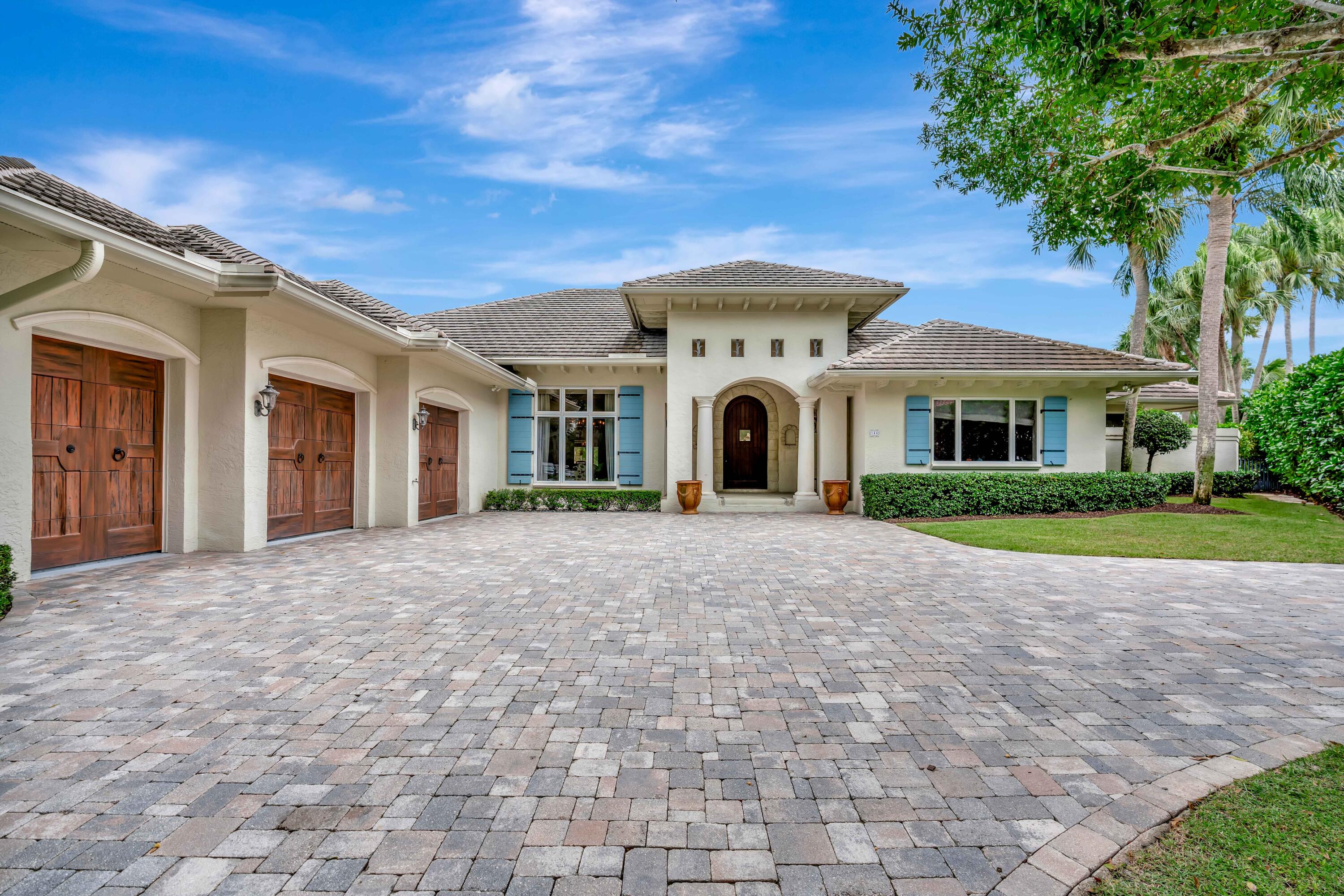 266 Locha Drive Jupiter, FL 33458 - Photo 48 of 60 a front view of a house with a yard