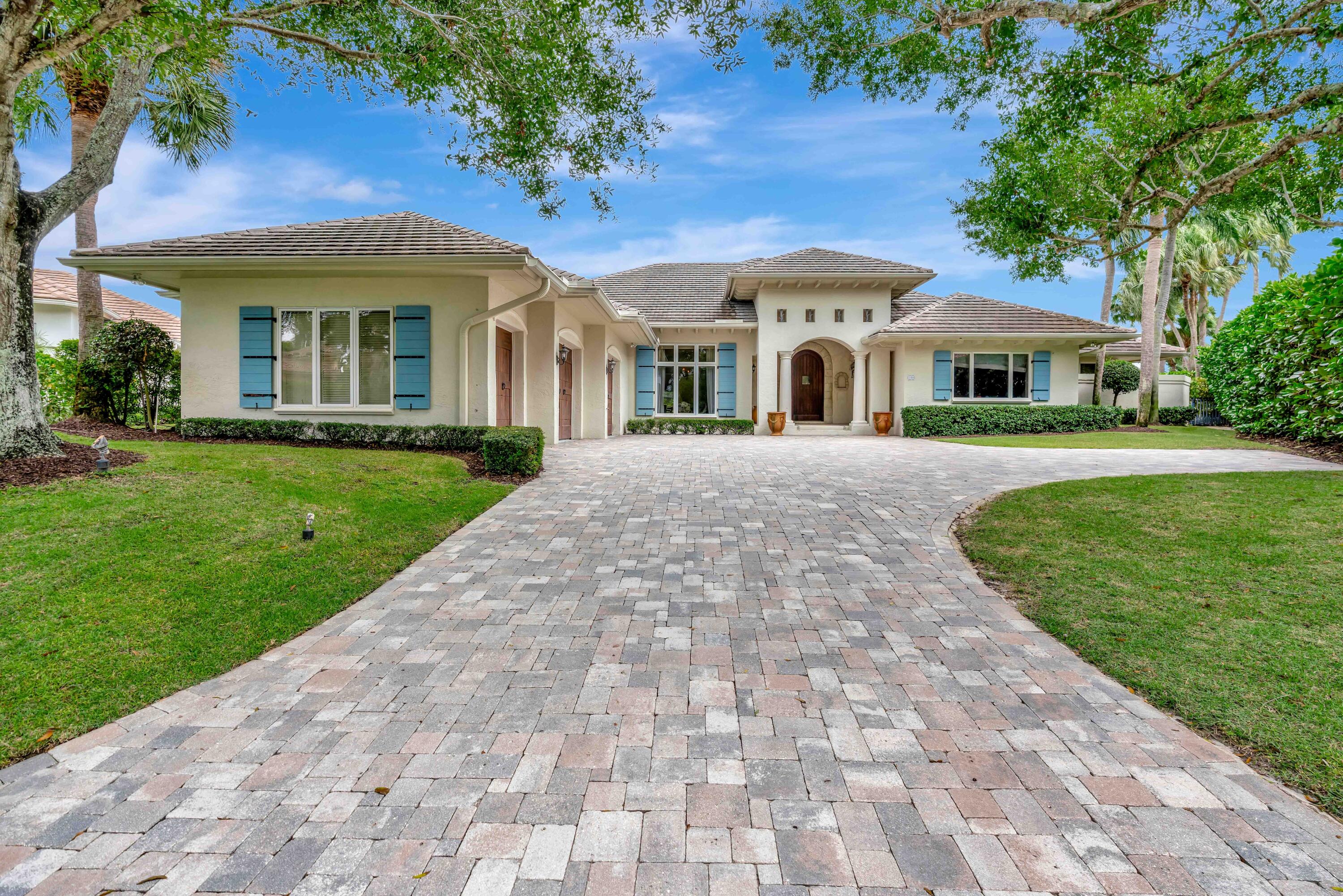 266 Locha Drive Jupiter, FL 33458 - Photo 50 of 60 front view of a house with a yard