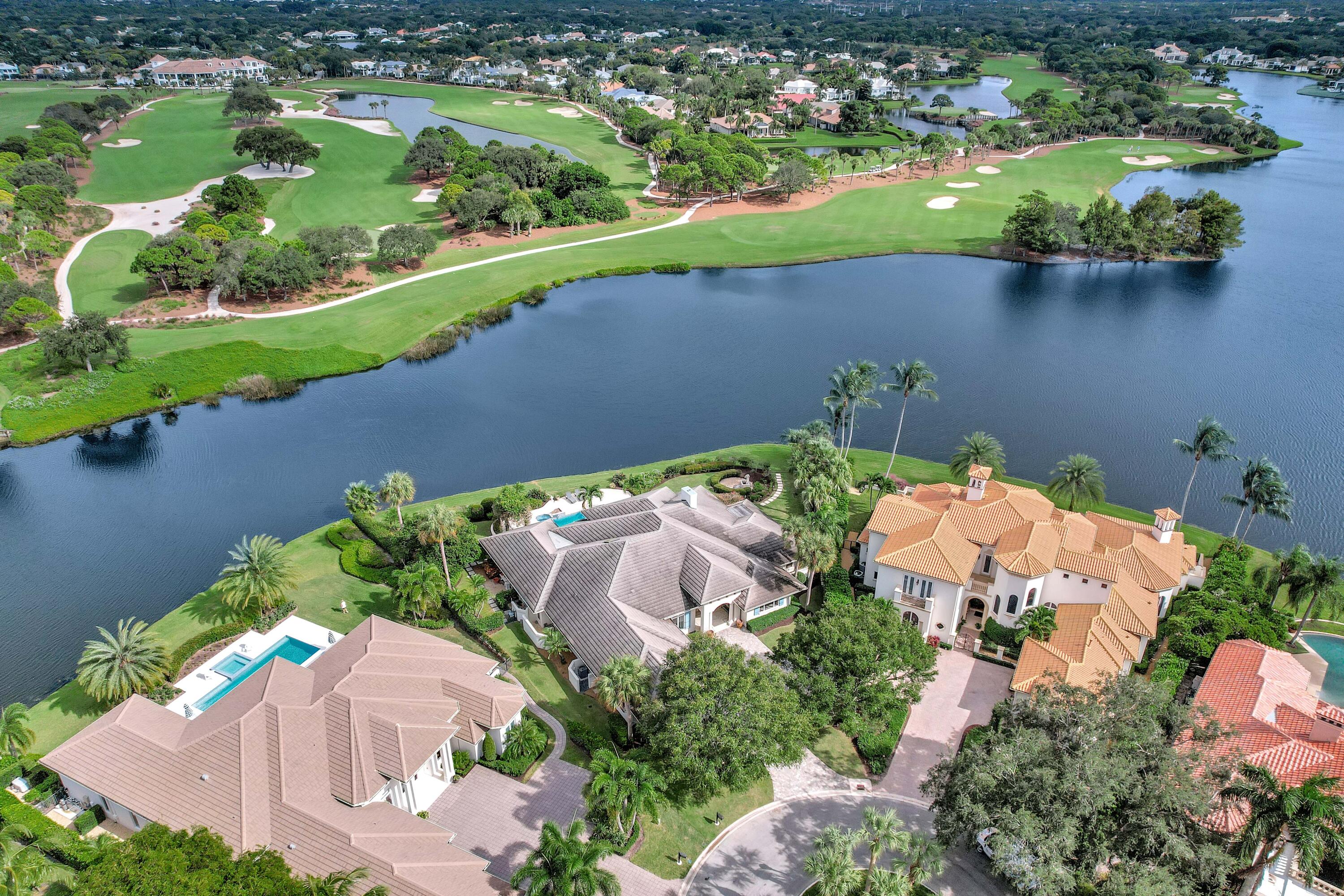266 Locha Drive Jupiter, FL 33458 - Photo 54 of 60 an aerial view of a house with a lake view
