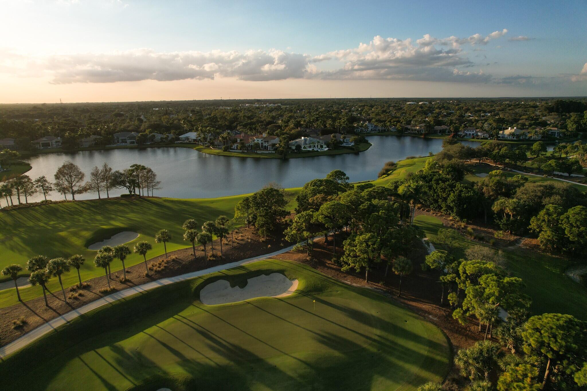 266 Locha Drive Jupiter, FL 33458 - Photo 55 of 60 a view of a lake in middle of the town