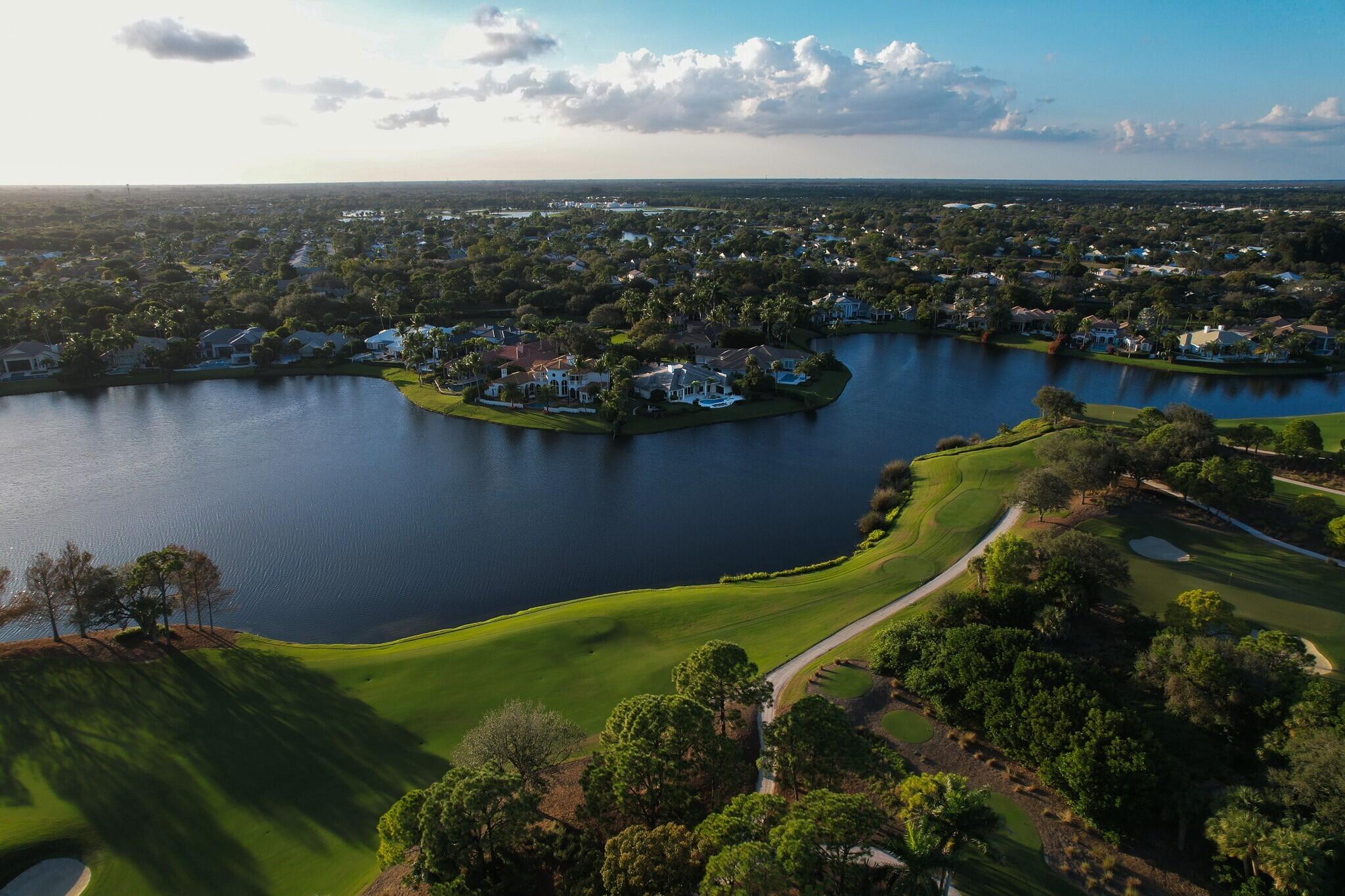 266 Locha Drive Jupiter, FL 33458 - Photo 56 of 60 an aerial view of a houses with a lake view