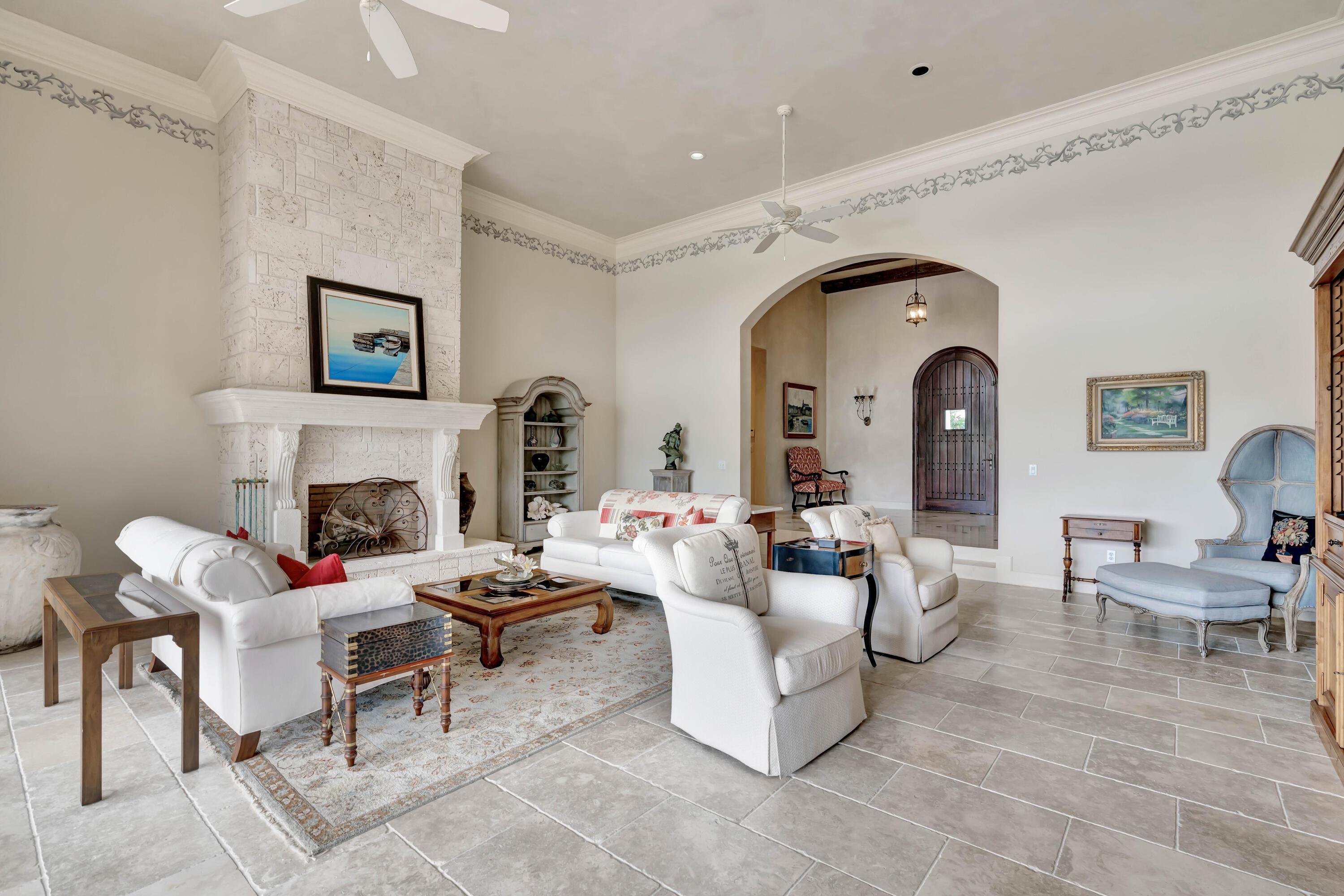 266 Locha Drive Jupiter, FL 33458 - Photo 9 of 60 a living room with furniture and a fireplace