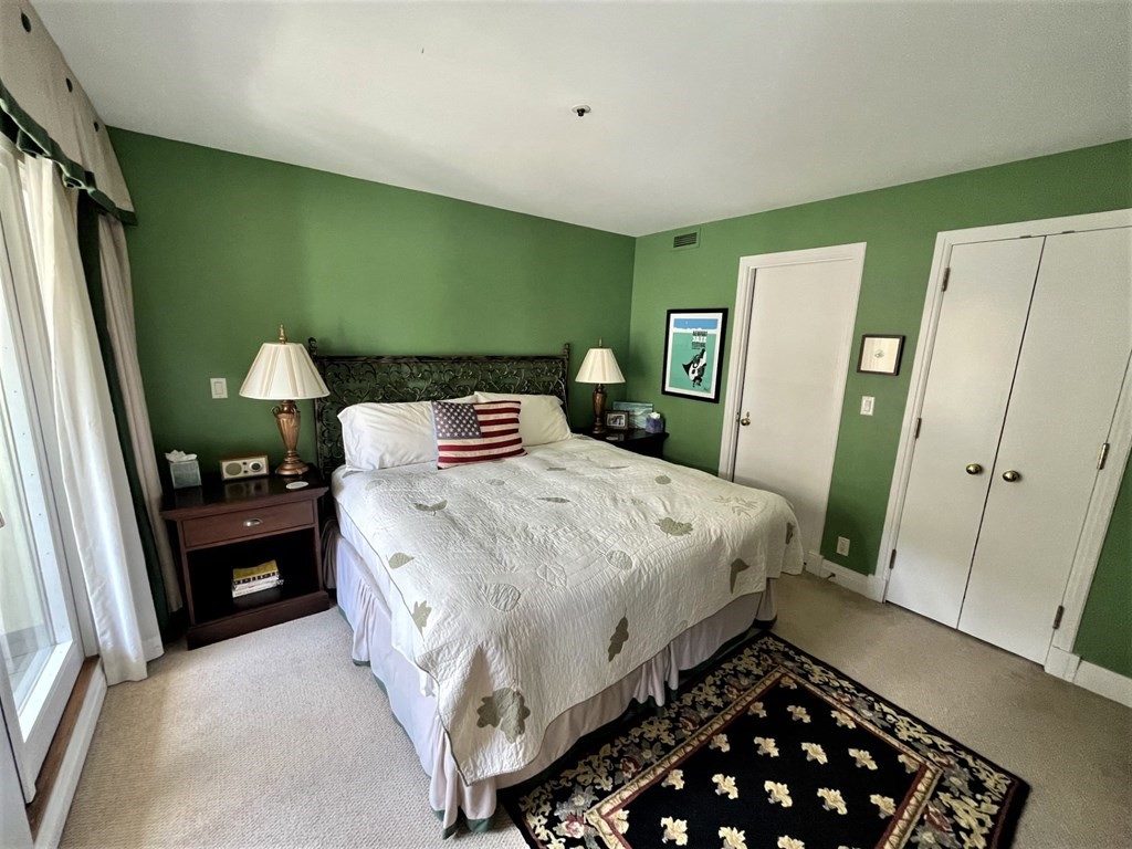 20 Rowes Wharf, Unit 604 Boston, MA 02110 - Photo 7 of 20 a bedroom with a bed and a mirror
