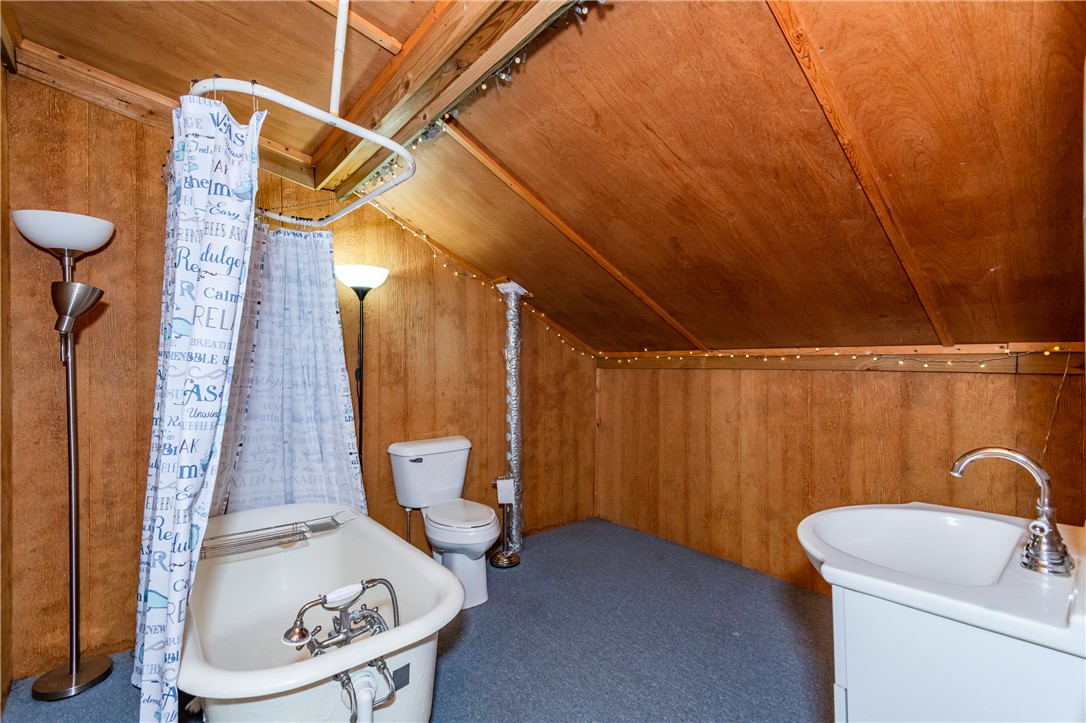6750 Little Twin Road Germantown, OH 45327 - Photo 61 of 88 This cozy bathroom retreat offers a freestanding tub and ample wooden finishes.