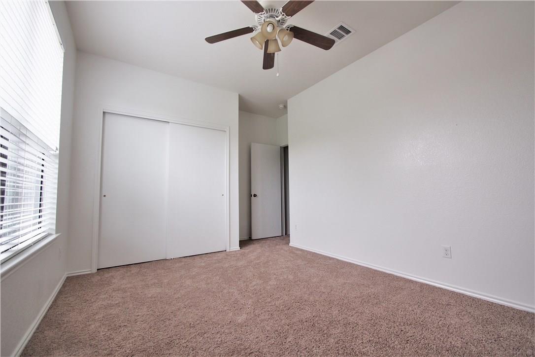 2204 Old Sterling Road Cedar Park, TX 78613 - Photo 12 of 22 an empty room with windows and fan