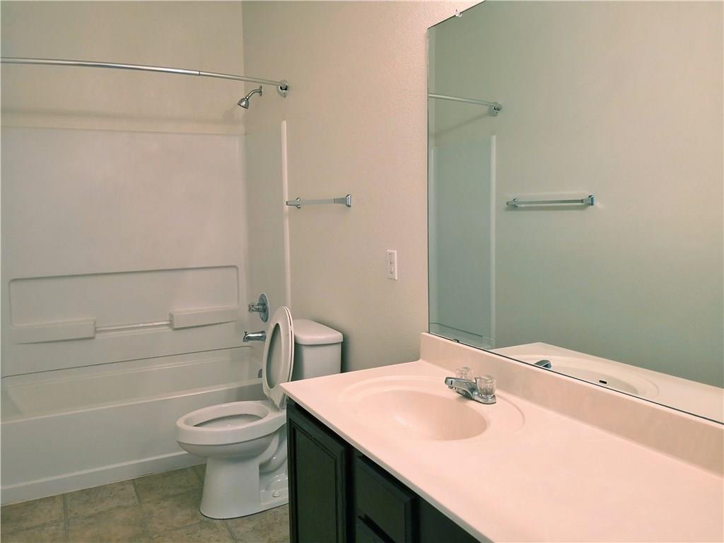 2204 Old Sterling Road Cedar Park, TX 78613 - Photo 13 of 22 a bathroom with a sink a toilet and shower