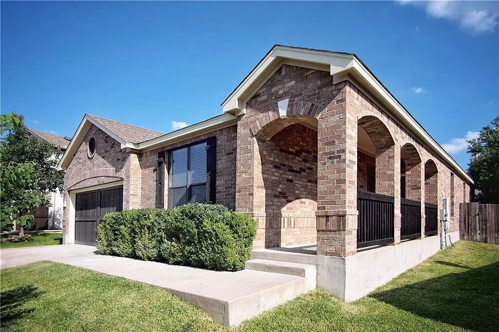 2204 Old Sterling Road Cedar Park, TX 78613 - Photo 2 of 22 a front view of a house with a yard
