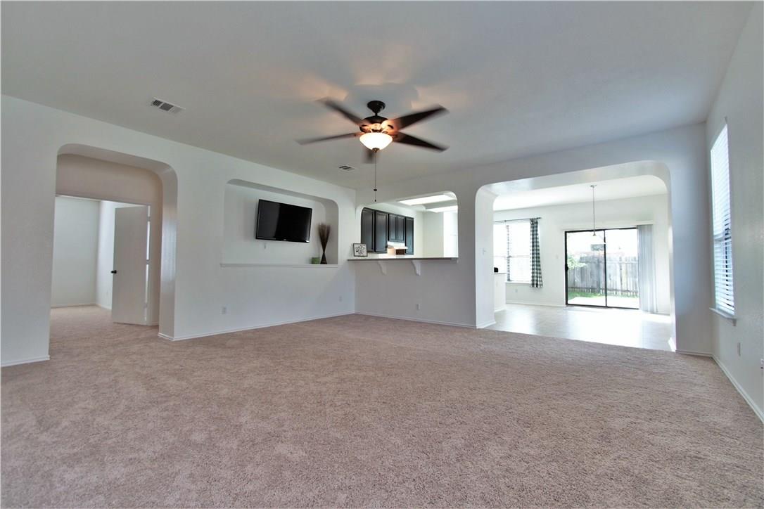 2204 Old Sterling Road Cedar Park, TX 78613 - Photo 4 of 22 a view of a big room with windows and chandelier fan