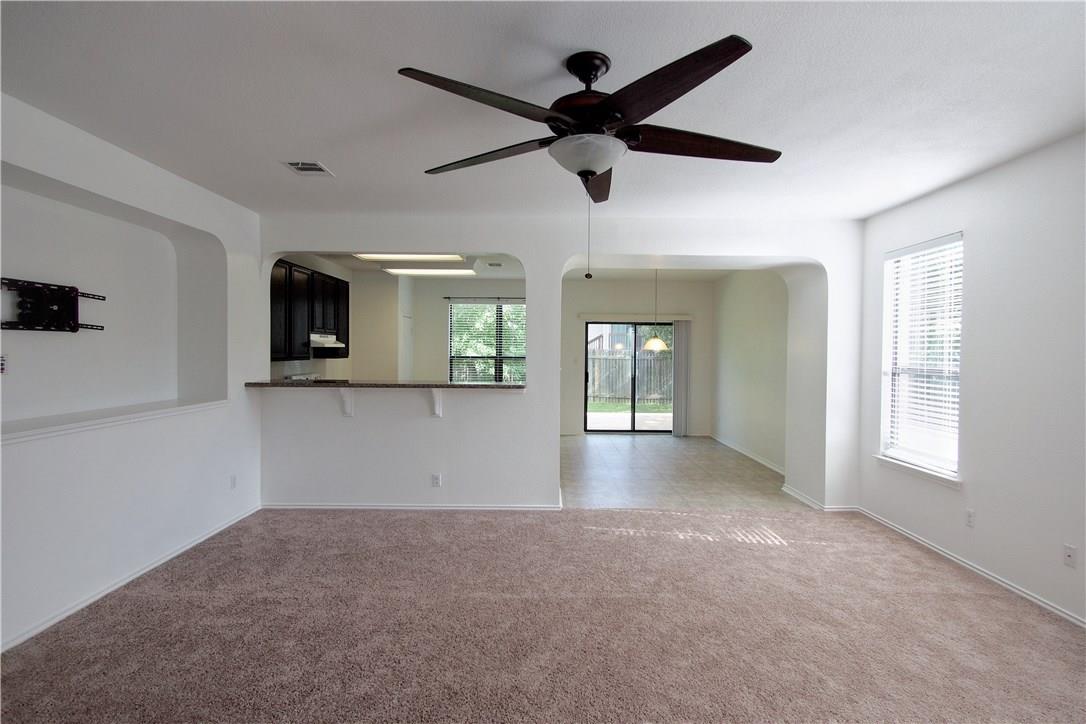 2204 Old Sterling Road Cedar Park, TX 78613 - Photo 5 of 22 a view of a livingroom with a ceiling fan and window