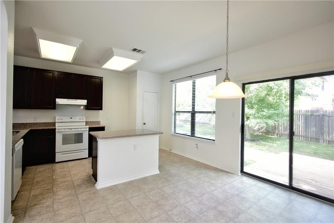 2204 Old Sterling Road Cedar Park, TX 78613 - Photo 6 of 22 a kitchen with a stove a sink and a refrigerator