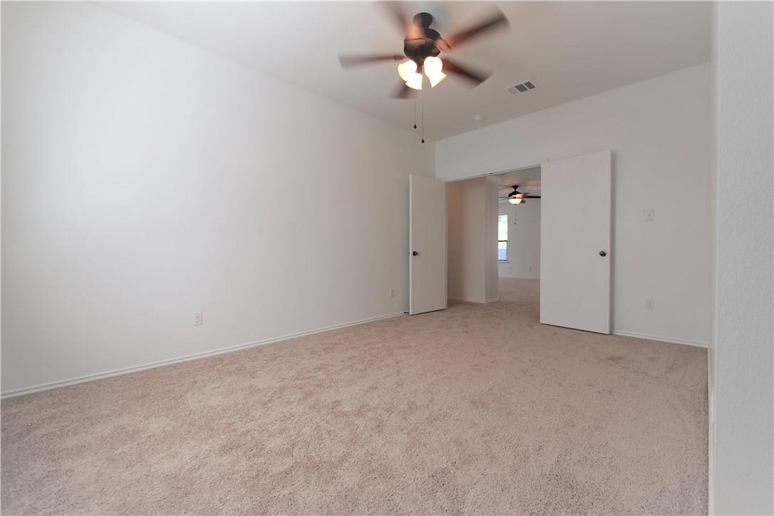 2204 Old Sterling Road Cedar Park, TX 78613 - Photo 10 of 22 an empty room with a ceiling fan and a fan