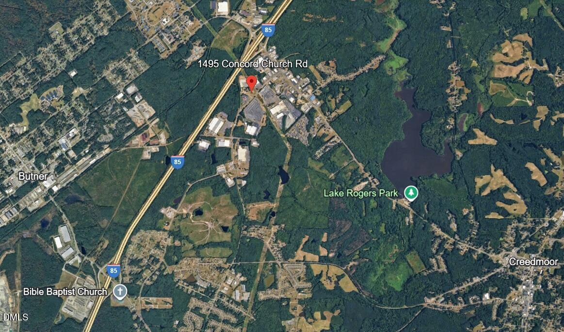 1495 Concord Church Road Creedmoor, NC 27522 - Photo 9 of 11 a yard with green space