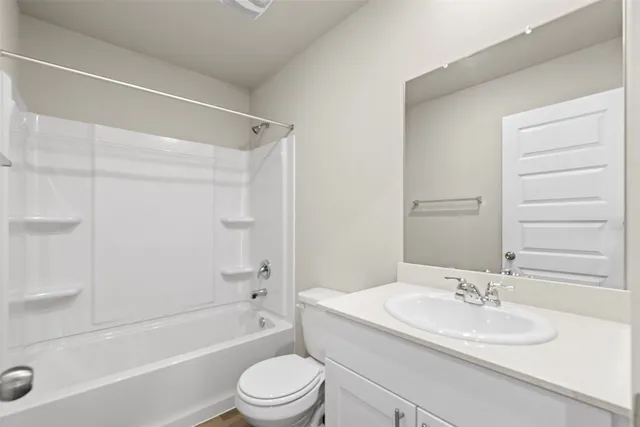 a bathroom with a sink a toilet and a bathtub