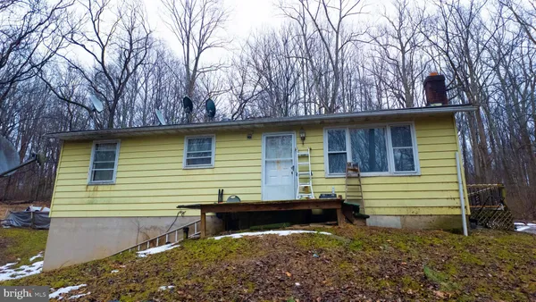 a side view of a house with a yard