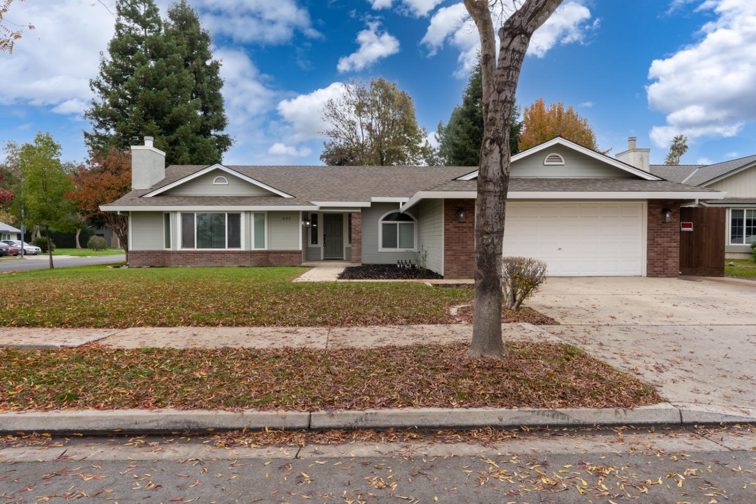 899 La Jolla Way Merced, CA 95348 - Photo 2 of 51 a front view of a house with a yard