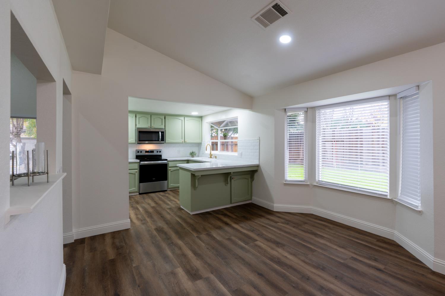 899 La Jolla Way Merced, CA 95348 - Photo 21 of 51 a kitchen with a refrigerator and a stove top oven