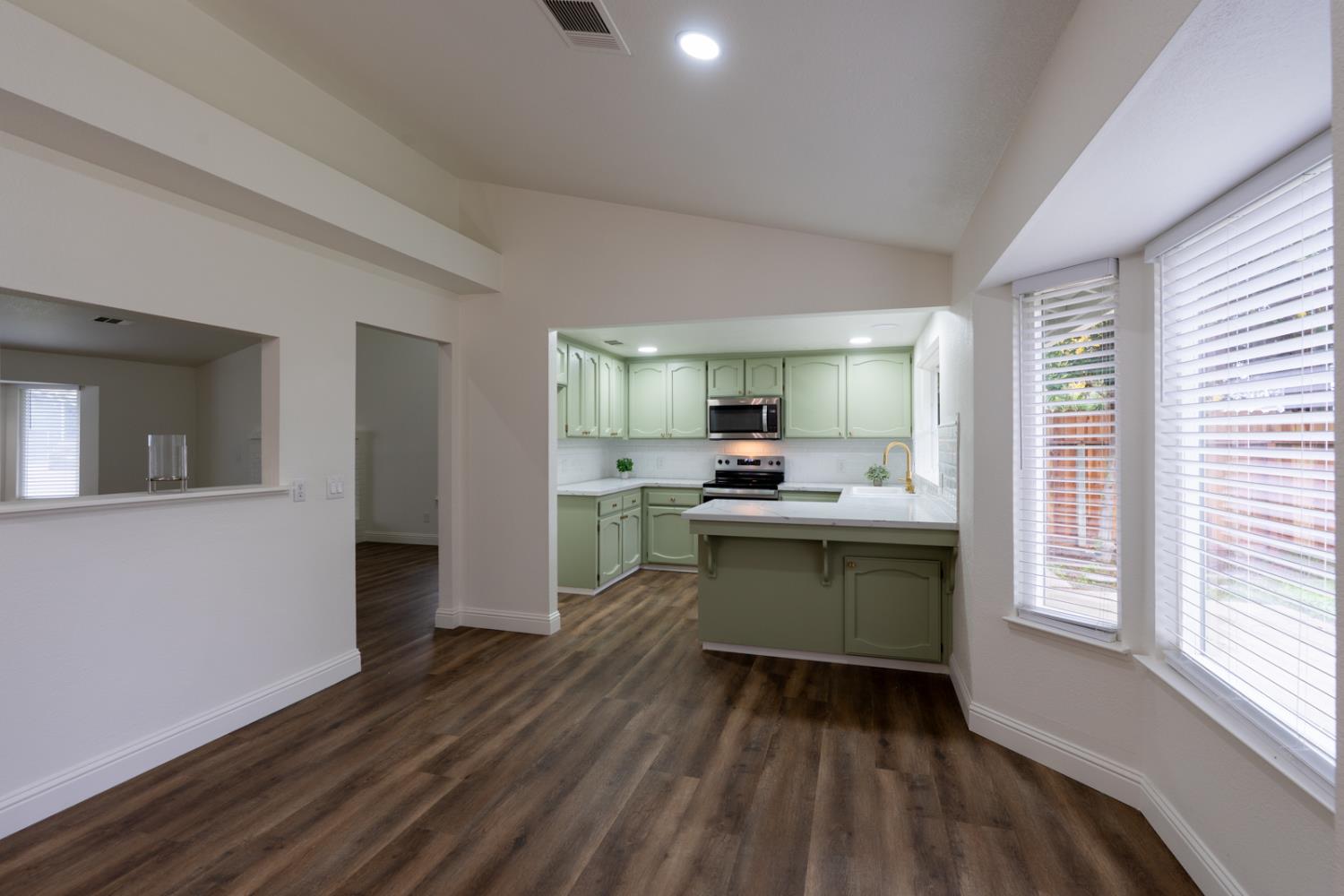 899 La Jolla Way Merced, CA 95348 - Photo 22 of 51 a kitchen with a refrigerator and a sink