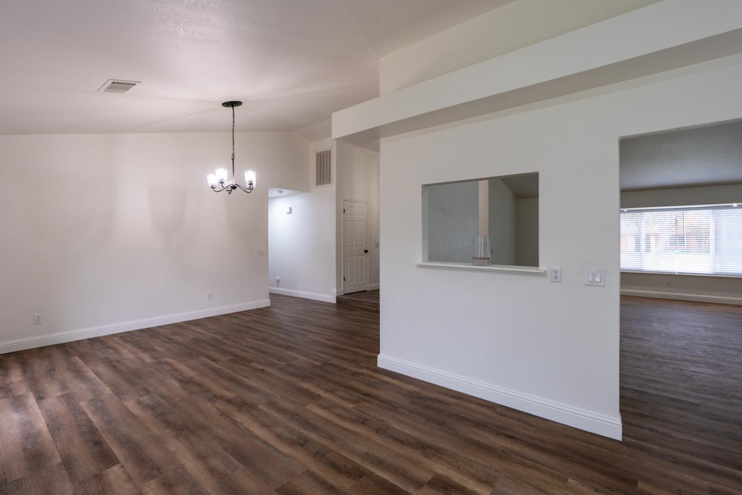 899 La Jolla Way Merced, CA 95348 - Photo 30 of 51 a view of empty room with wooden floor
