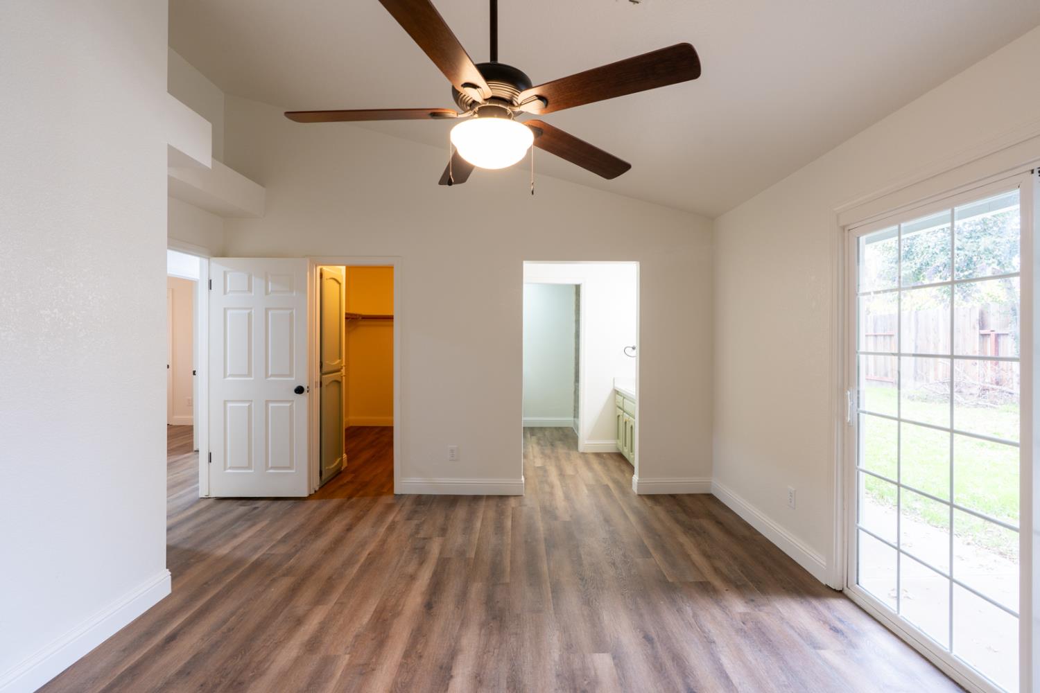 899 La Jolla Way Merced, CA 95348 - Photo 34 of 51 wooden floor in an empty room with a window