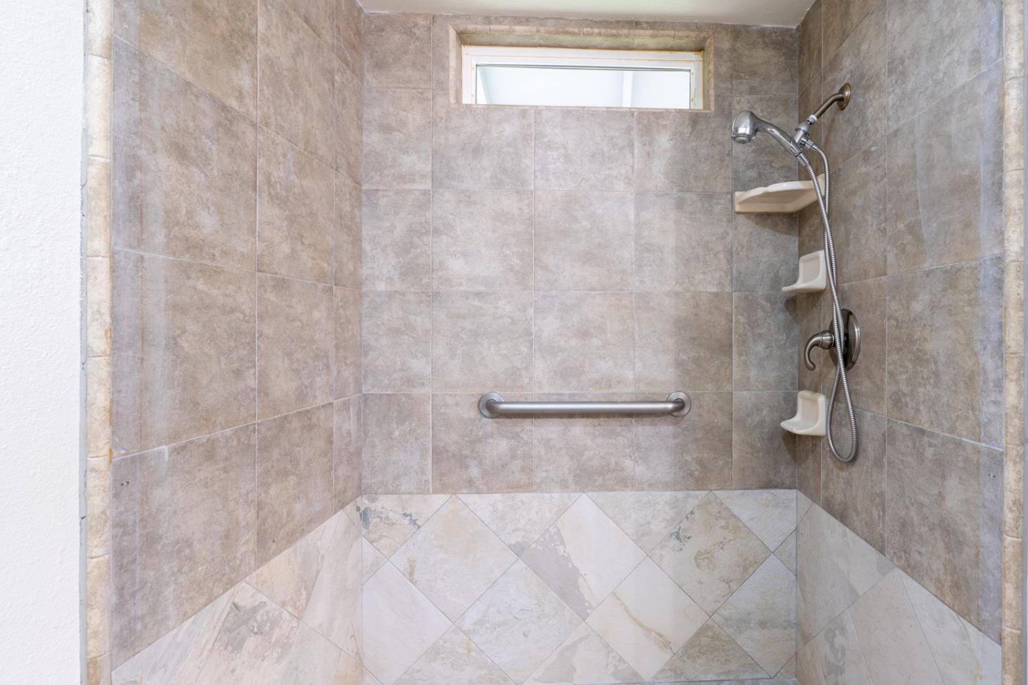 899 La Jolla Way Merced, CA 95348 - Photo 40 of 51 a bathroom with a shower