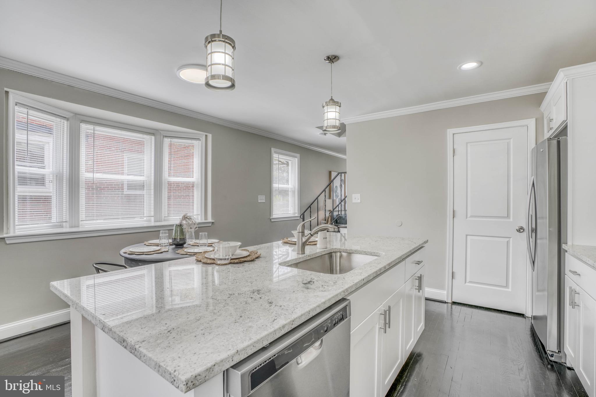 6209 Pilgrim Road Baltimore, MD 21214 - Photo 22 of 56 Island has sink and dishwasher