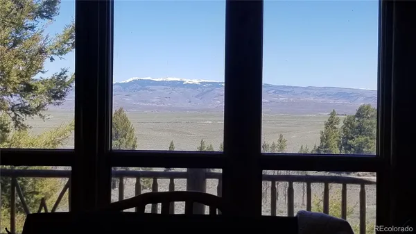a view of a balcony with wooden floor