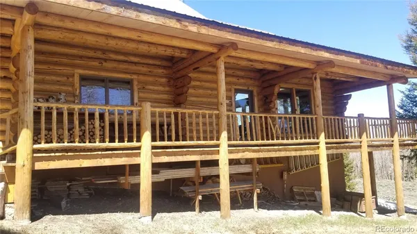 a view of a balcony with wooden fence and floor