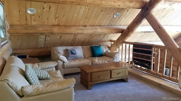 a bed room with a bed and a chair