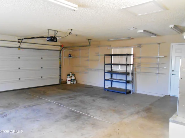 a view of an empty room and bathroom