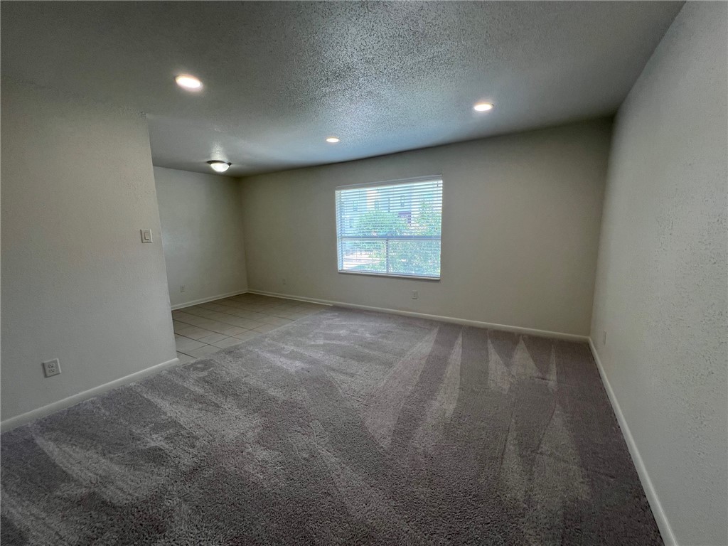 806 Natalie Street, Unit D Bryan, TX 77801 - Photo 2 of 7 an empty room with a window