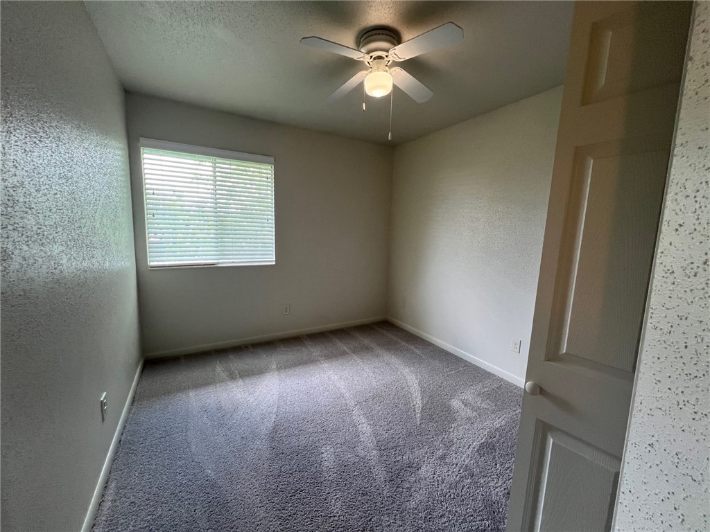 806 Natalie Street, Unit D Bryan, TX 77801 - Photo 4 of 7 a view of an empty room with a window