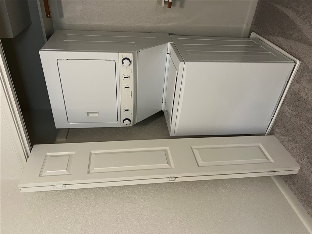 806 Natalie Street, Unit D Bryan, TX 77801 - Photo 7 of 7 a utility room with dryer and washer