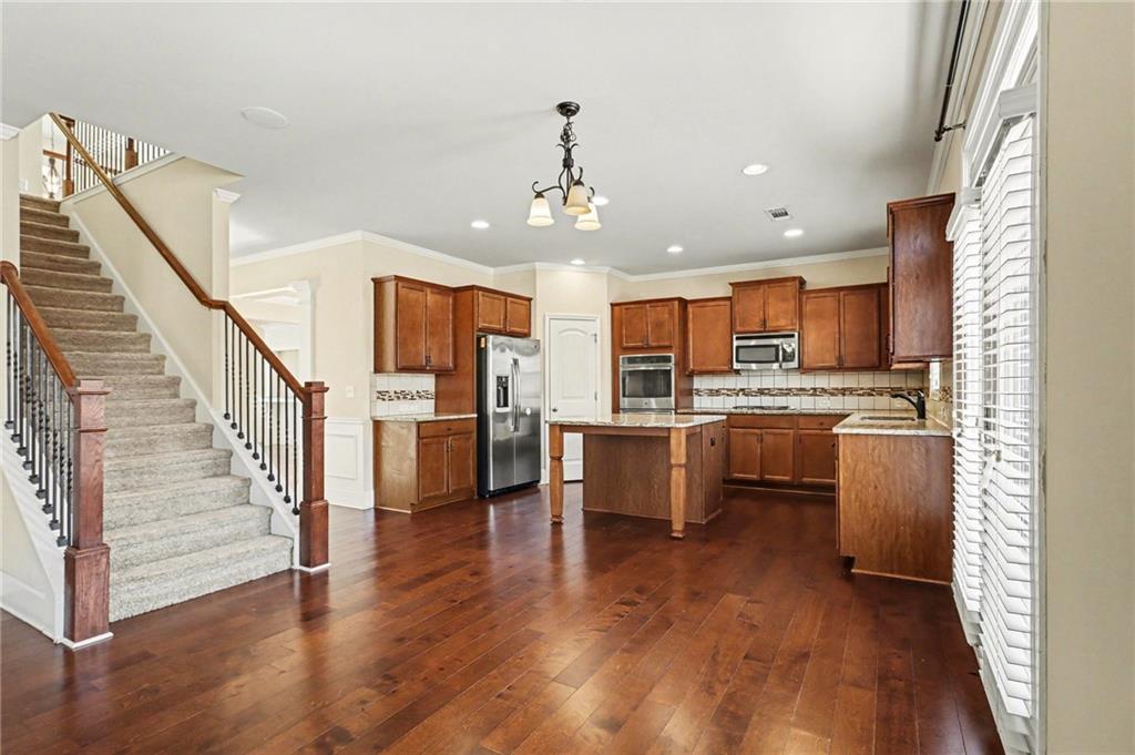 4208 Amberleaf Walk Lilburn, GA 30047 - Photo 12 of 33 a view of kitchen with sink and refrigerator