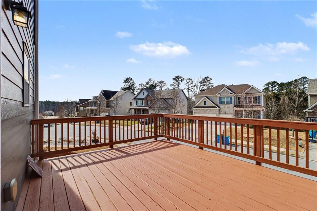 4208 Amberleaf Walk Lilburn, GA 30047 - Photo 30 of 33 a view of a balcony with wooden floor