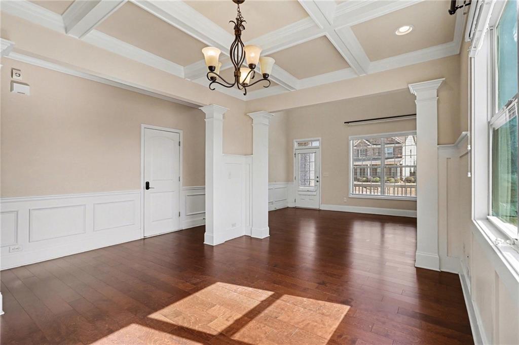 4208 Amberleaf Walk Lilburn, GA 30047 - Photo 8 of 33 a view of an empty room with wooden floor and a window