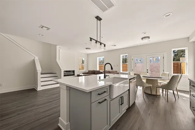 a kitchen with center island and sink