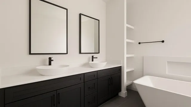 a bathroom with a double vanity sink mirror and bathtub