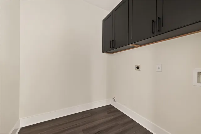 a view of door with wooden floor