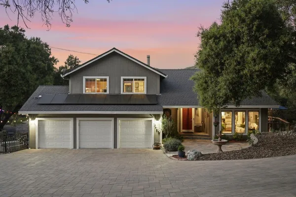 a front view of a house with garage