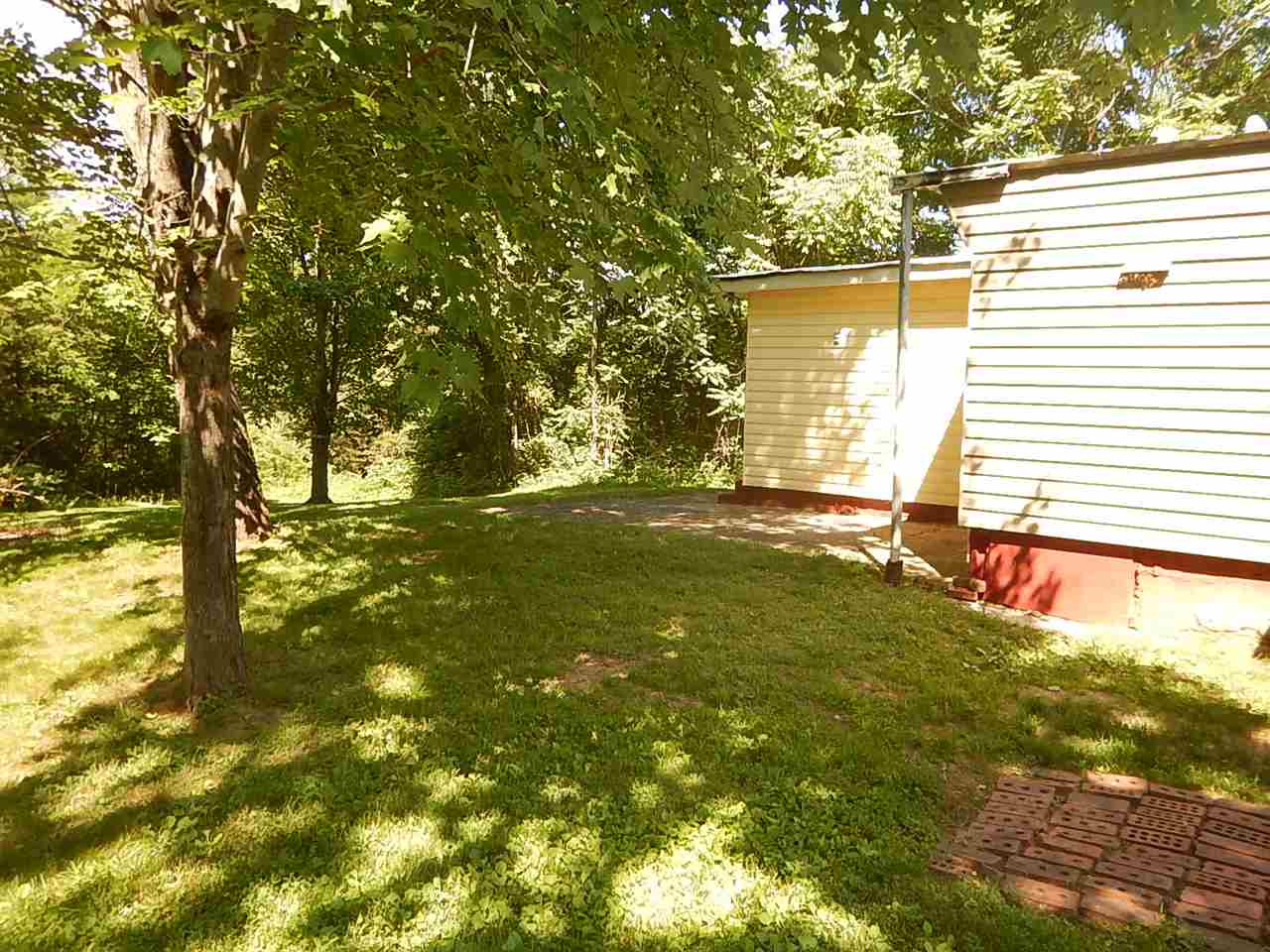 2571 Rileyville Road Rileyville, VA 22650 - Photo 25 of 28 a backyard of a house with yard and outdoor seating
