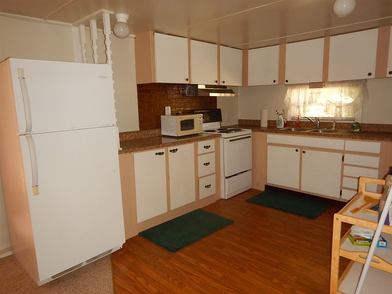 2571 Rileyville Road Rileyville, VA 22650 - Photo 4 of 28 a kitchen with cabinets and wooden floor