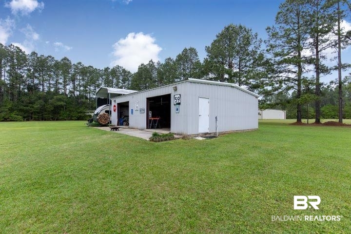 24541 Baldwin Beach Expressway Robertsdale, AL 36567 - Photo 32 of 51 View of pole building with a yard