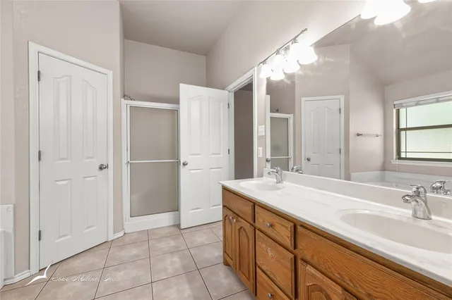 a bathroom with a bathtub and a sink