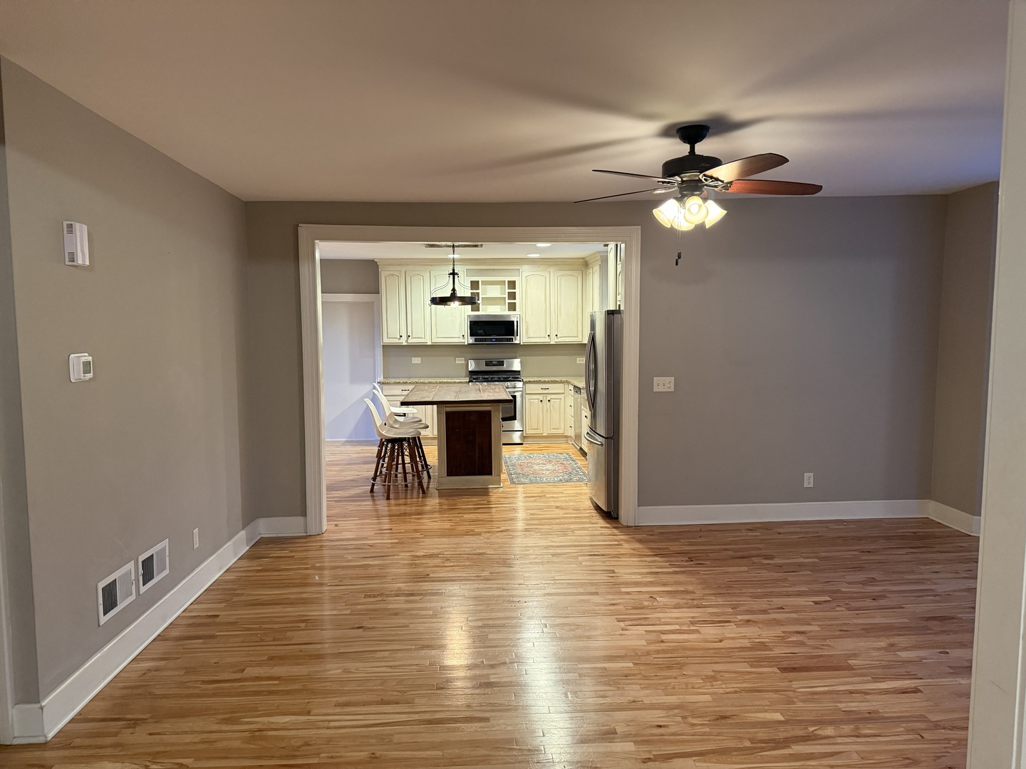 42W546 Highway 64 St. Charles, IL 60175 - Photo 5 of 18 a view of a dining room with furniture a chandelier and wooden floor
