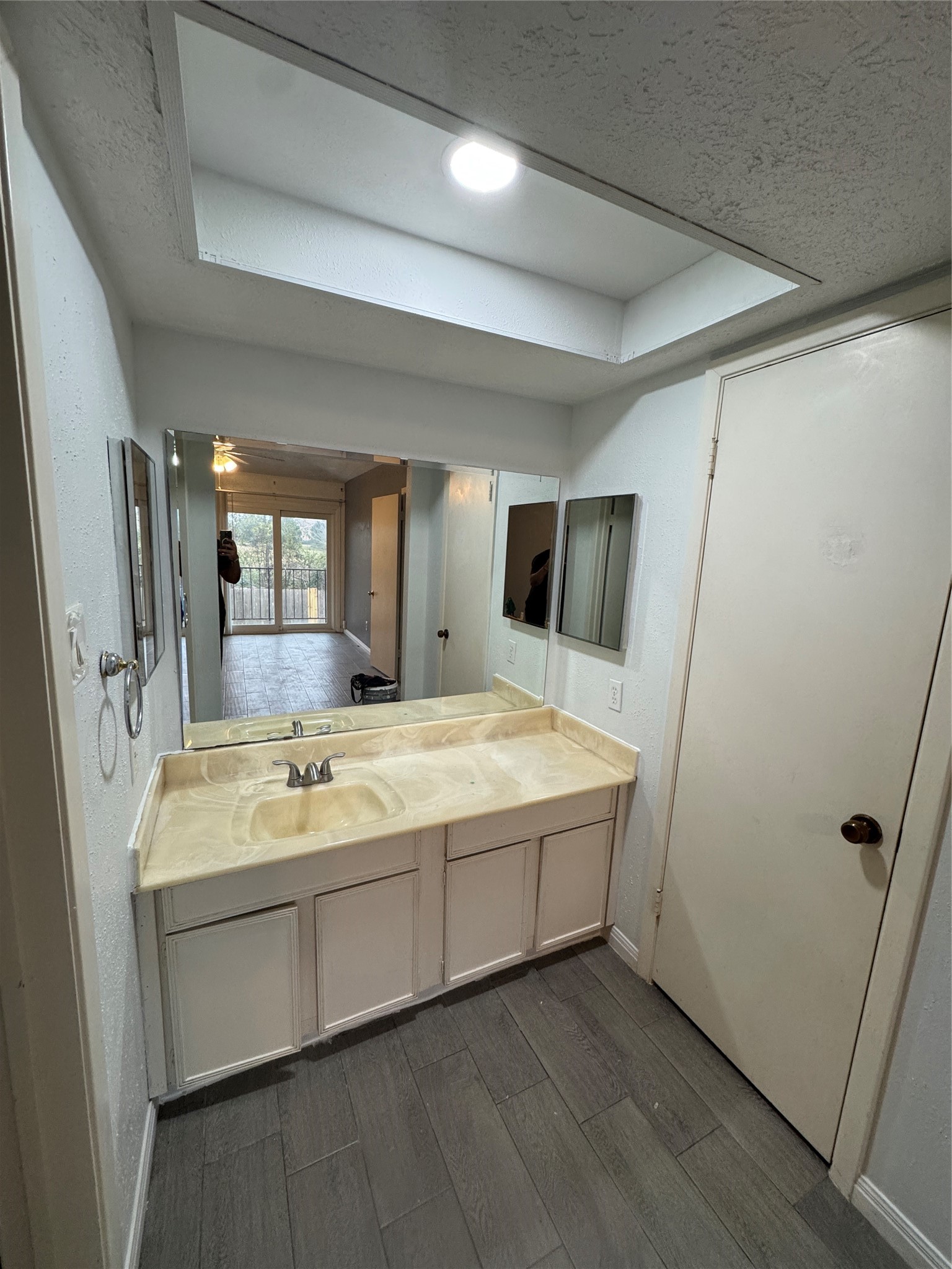 8523 Redcliff Road Houston, TX 77064 - Photo 3 of 4 a bathroom with a tub sink and mirror