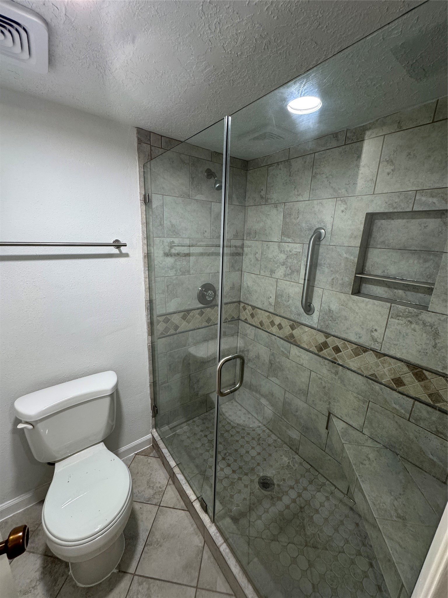 8523 Redcliff Road Houston, TX 77064 - Photo 4 of 4 a bathroom with a toilet and a shower