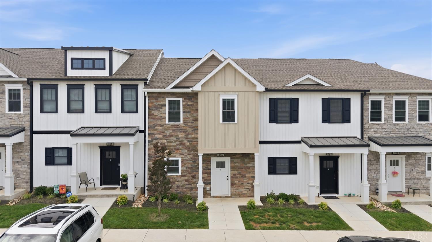 556 Leesville Road, Unit 406 Lynchburg, VA 24502 - Photo 1 of 39 a front view of a house with yard and green space